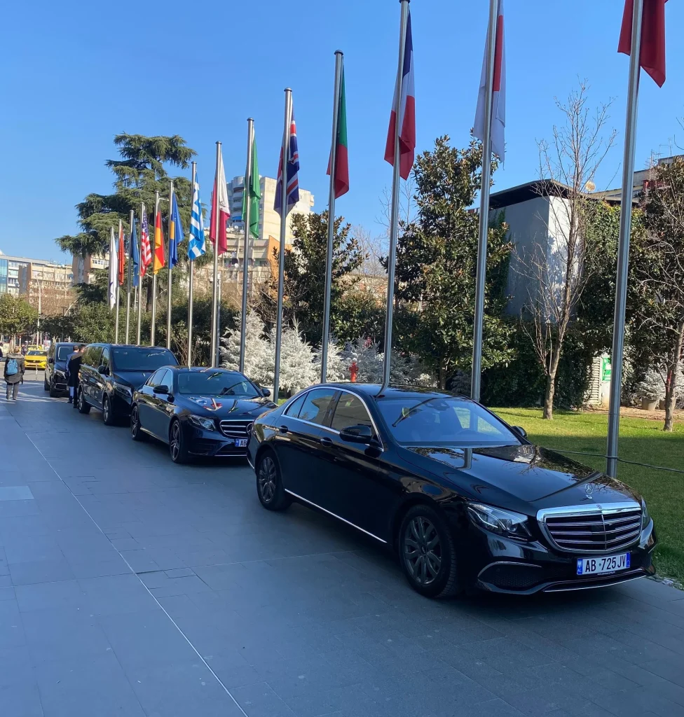 Overview DMC fleet lined up outside a government building in Tirana