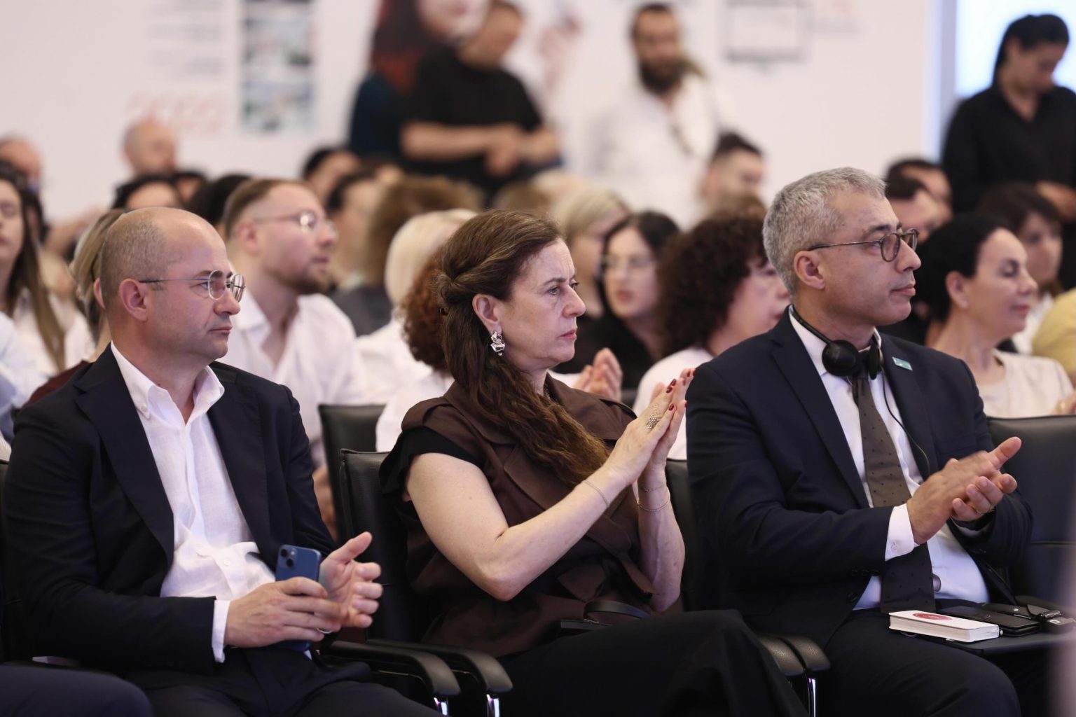 Delegates using simultaneous interpretation headsets at a congress in Tirana