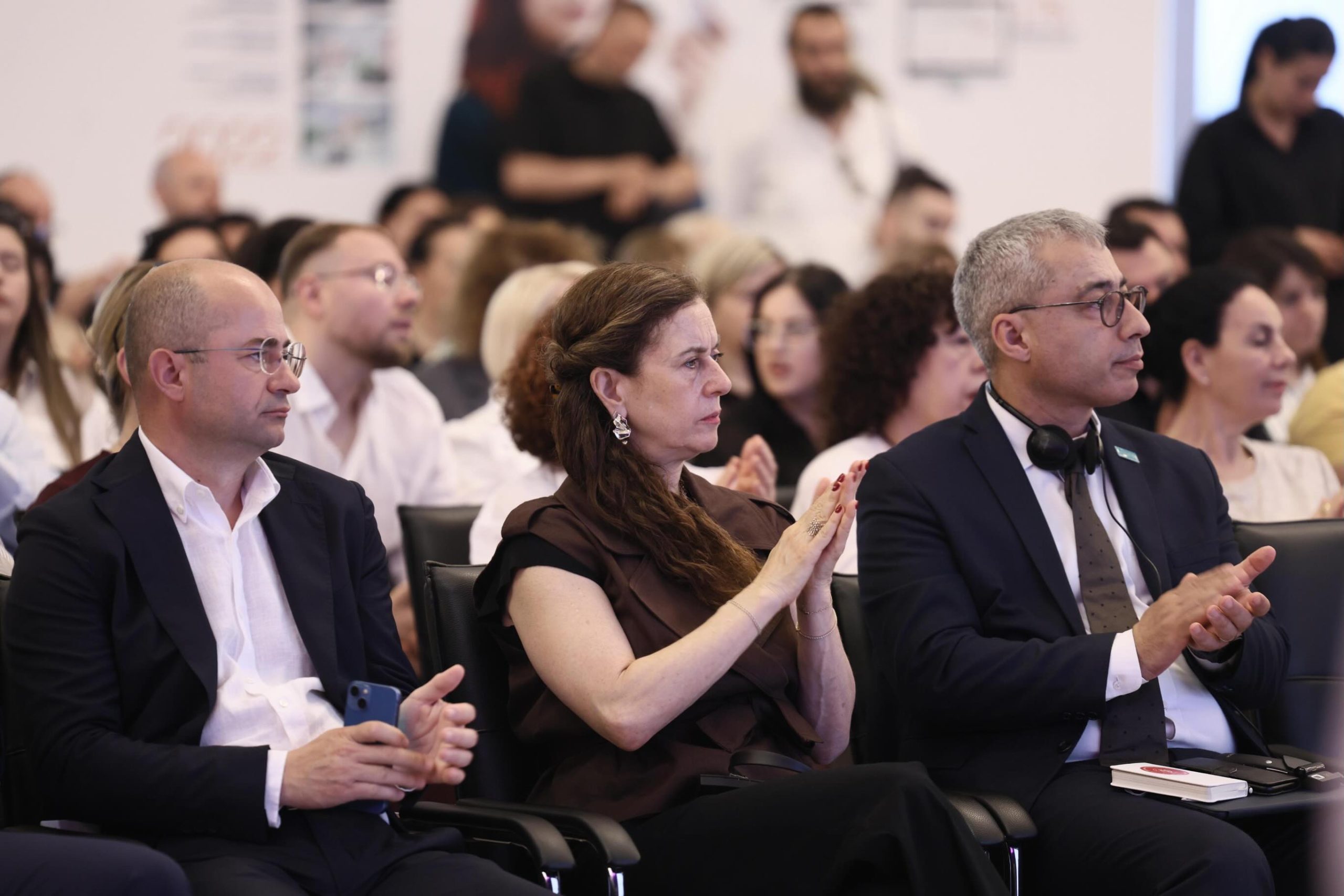 Conference delegates following sessions with simultaneous interpretation headsets at the National Vocational Education and Training Conference 2026 in Tirana