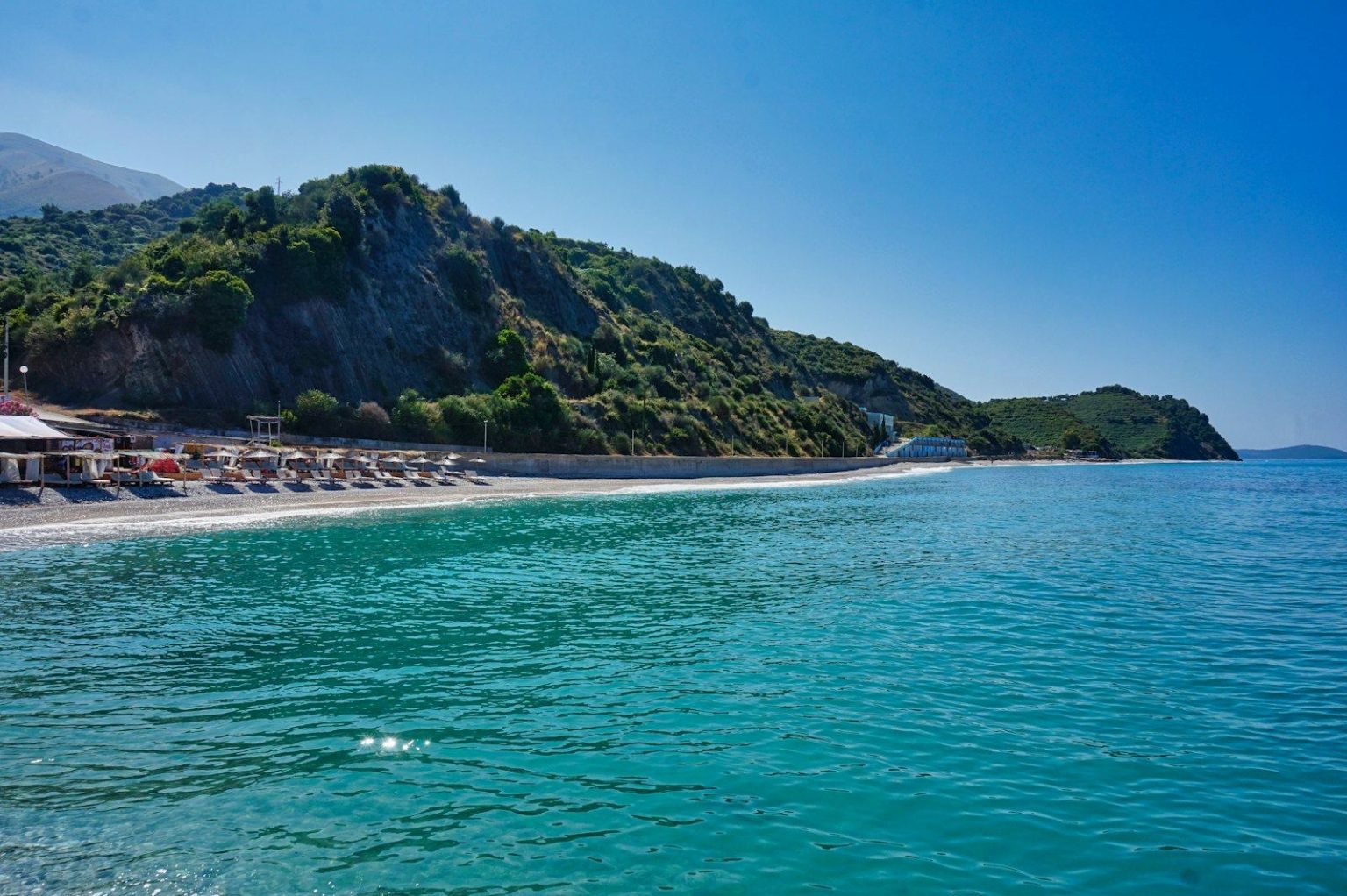 A cove on the Albanian Riviera where the mountains drop straight into the sea