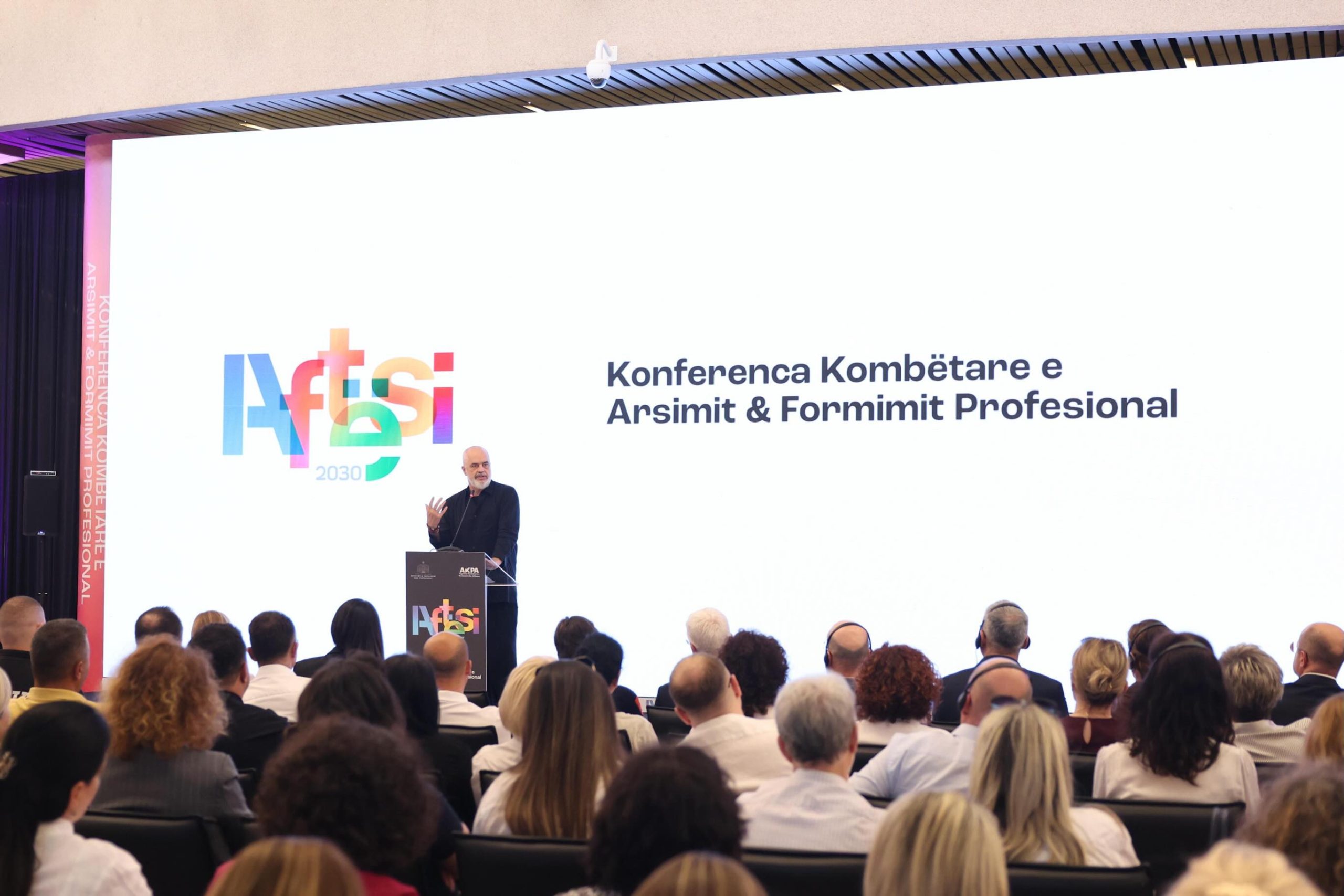 Prime Minister of Albania Edi Rama addressing the National Vocational Education and Training Conference 2026 on an LED stage in Tirana