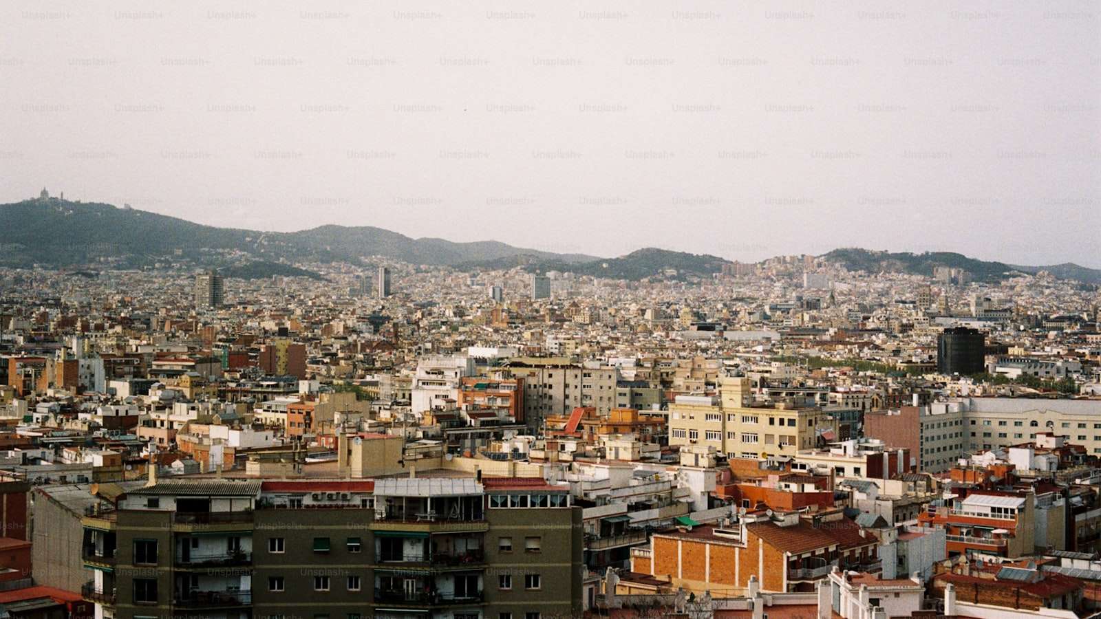 Aerial view of Tirana with conference venues and the Albanian Alps in the distance
