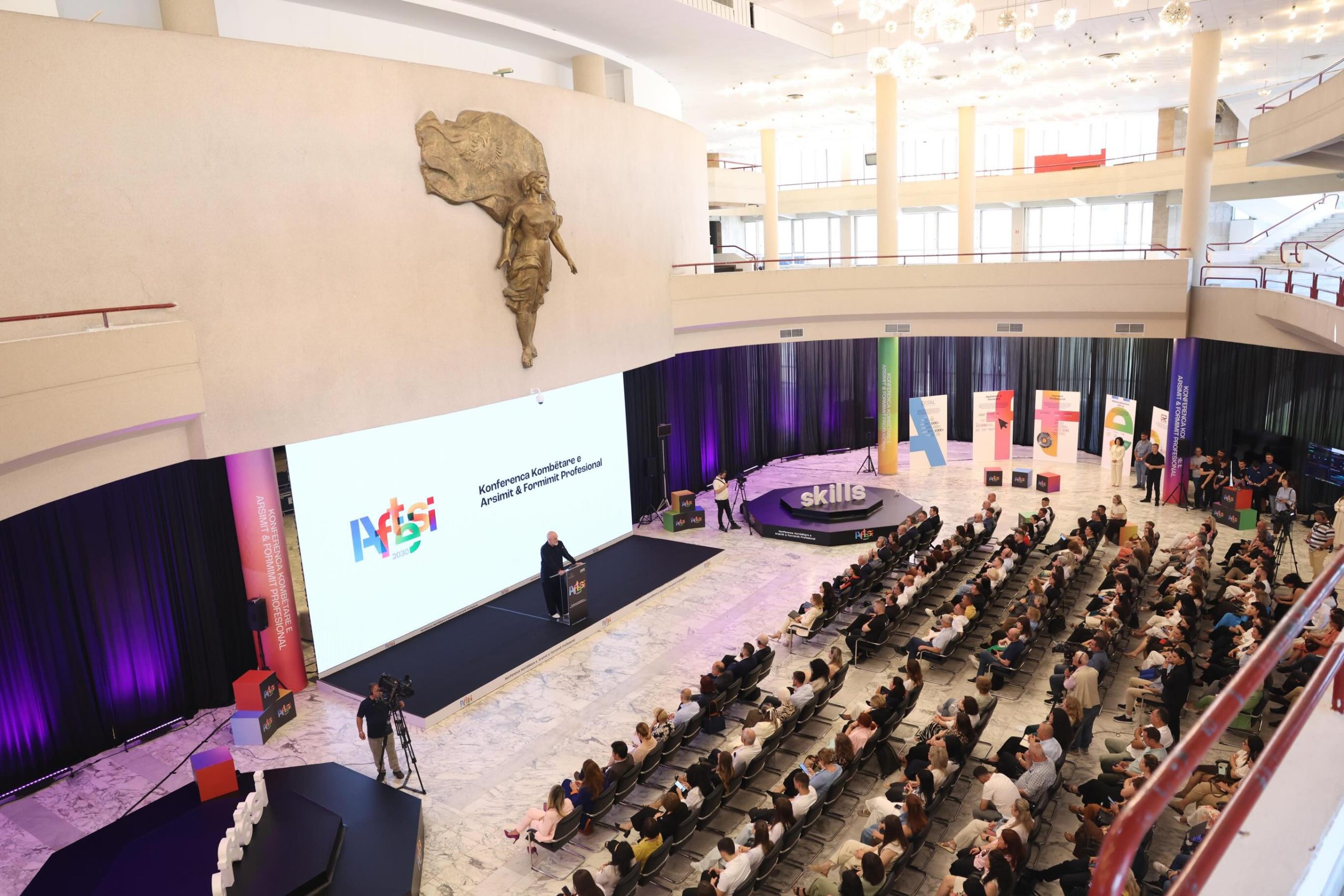 Wide view of the National Vocational Education and Training Conference 2026 at the Palace of Congresses in Tirana with LED stage, lighting and full audience — event production by Overview DMC