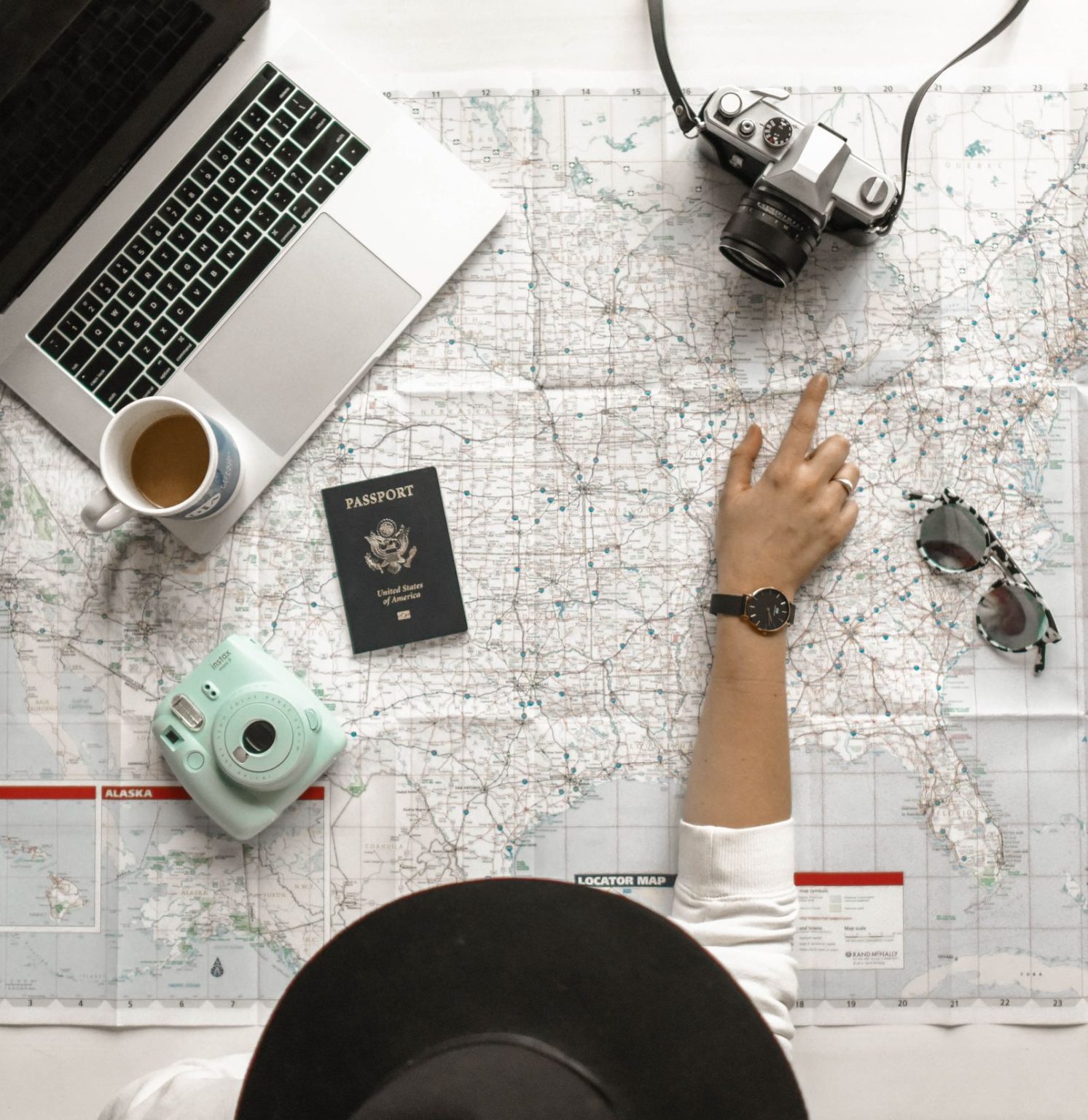Planning a destination route on a printed map, the work an international agency hands to its local DMC partner in Albania