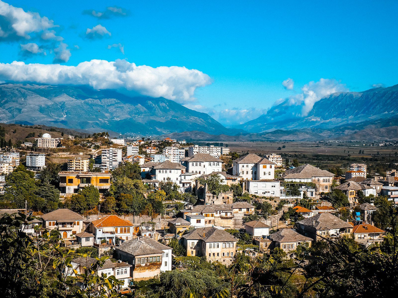 An Albanian town in a mountain valley, where corporate event costs run below Tirana rates
